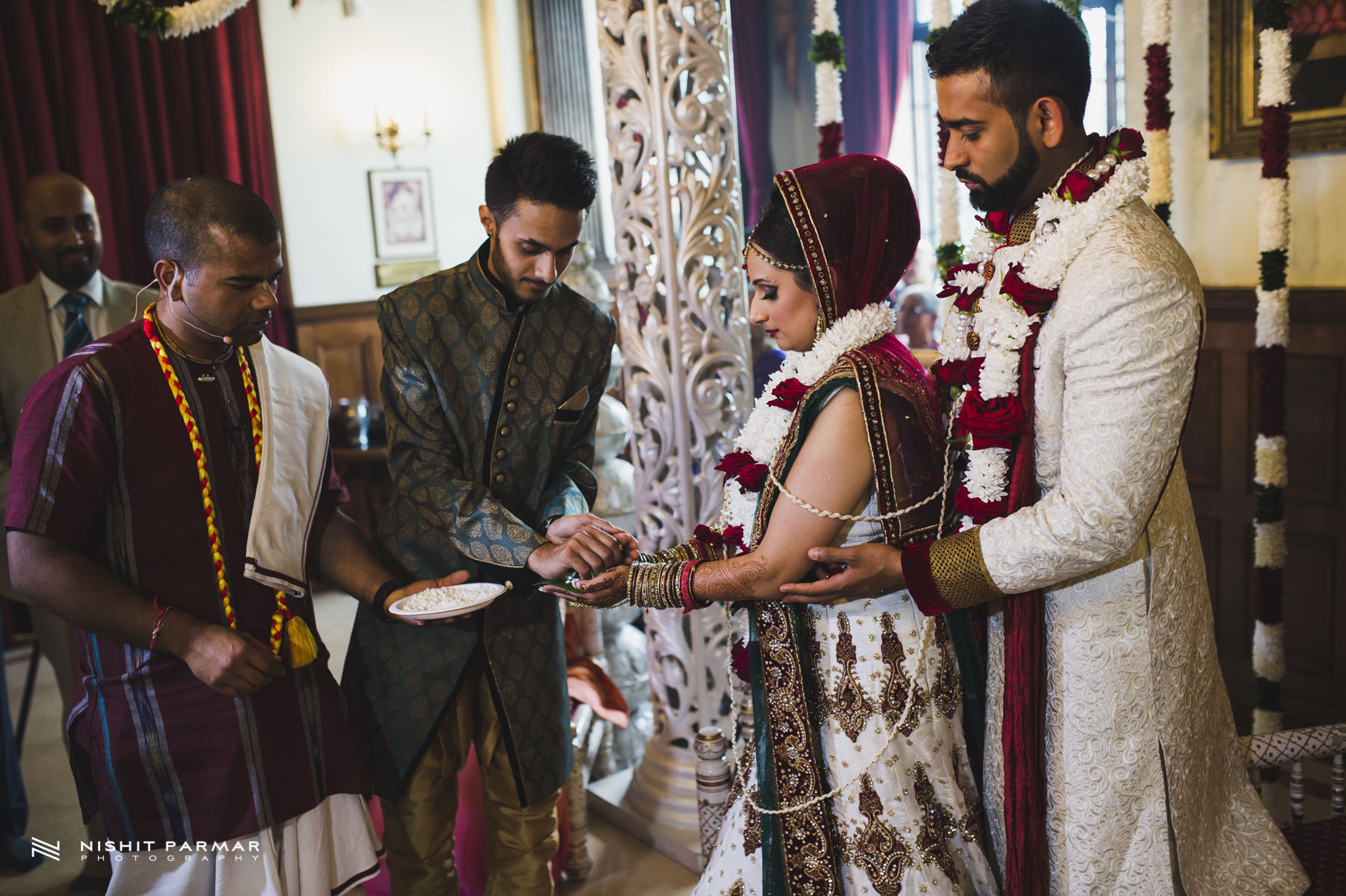 Brother blessing bride and groom