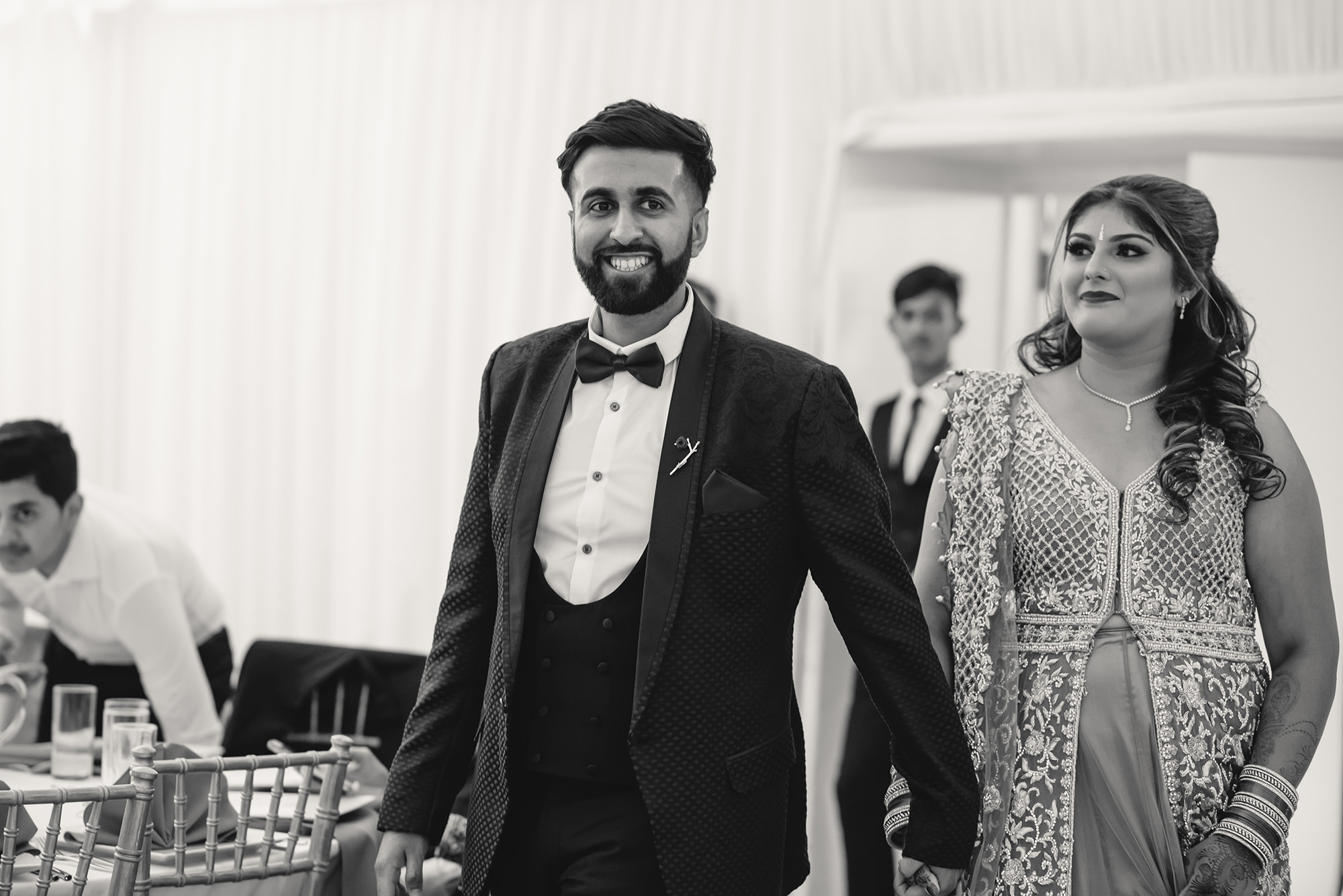 bride and groom entering their wedding reception
