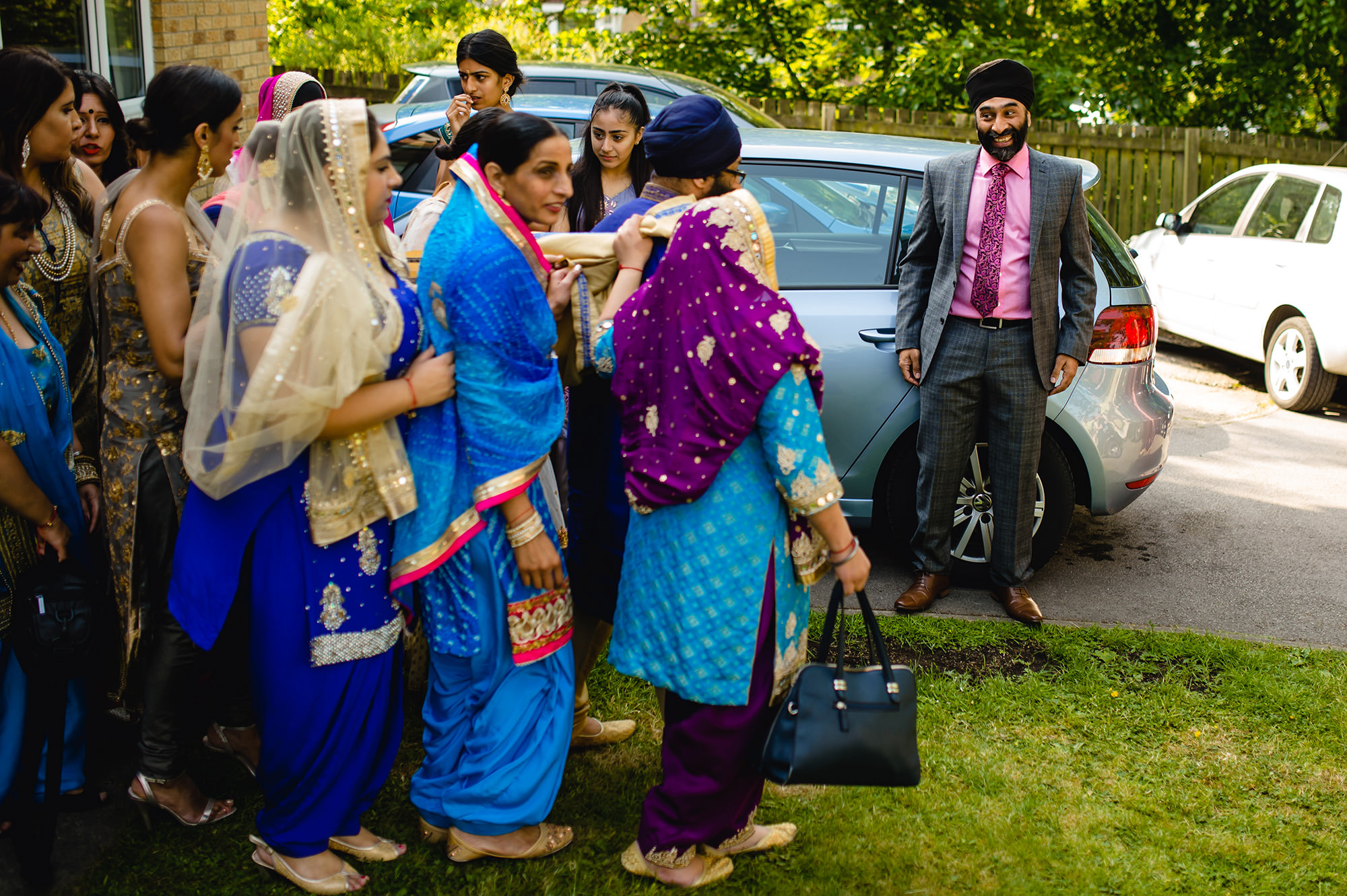 groom leaving his home to make his way to his sikh wedding in leeds