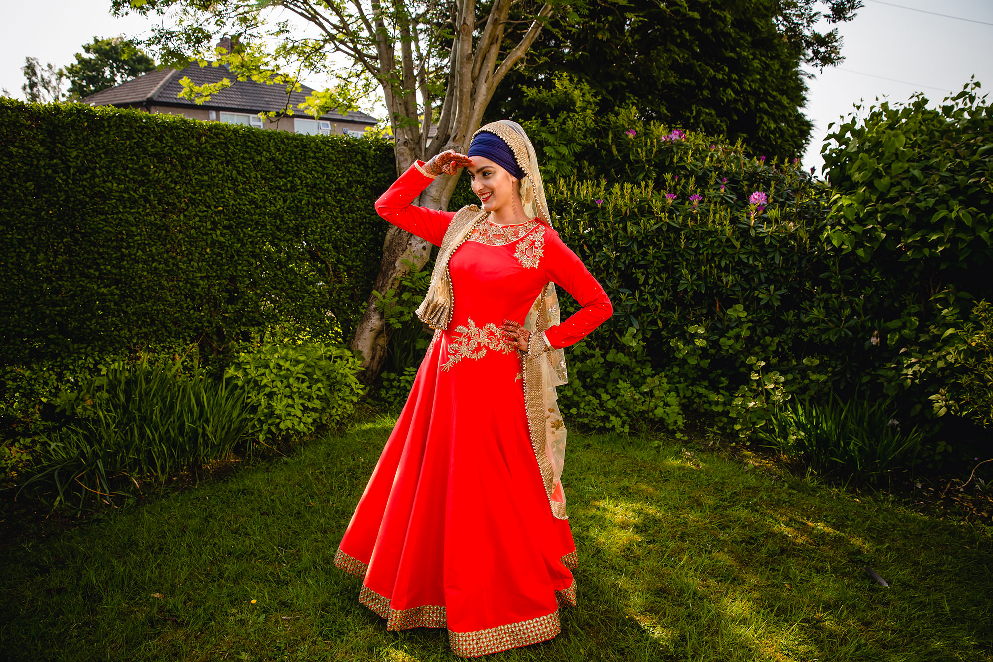 bridal portrait in her garden in her indian wedding outfit