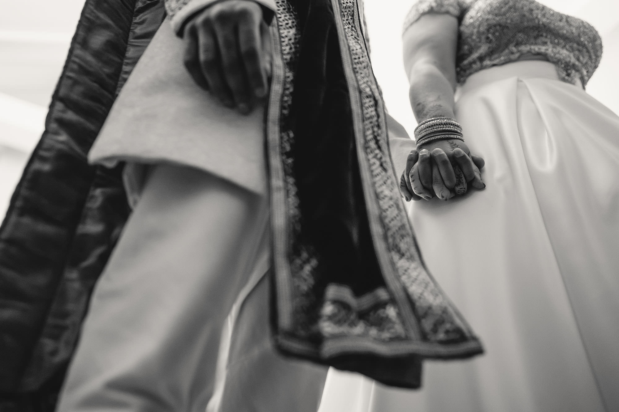 bride and groom holding hands during ceremony