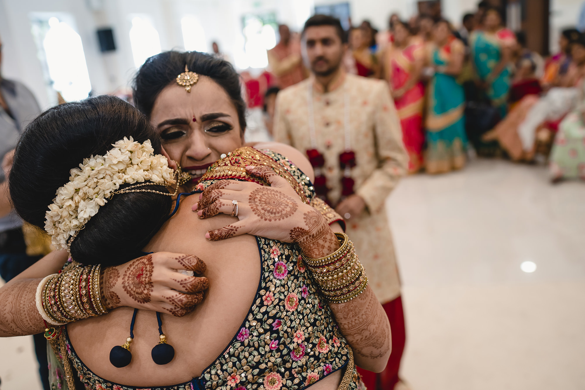 emotional hindu bride with parents