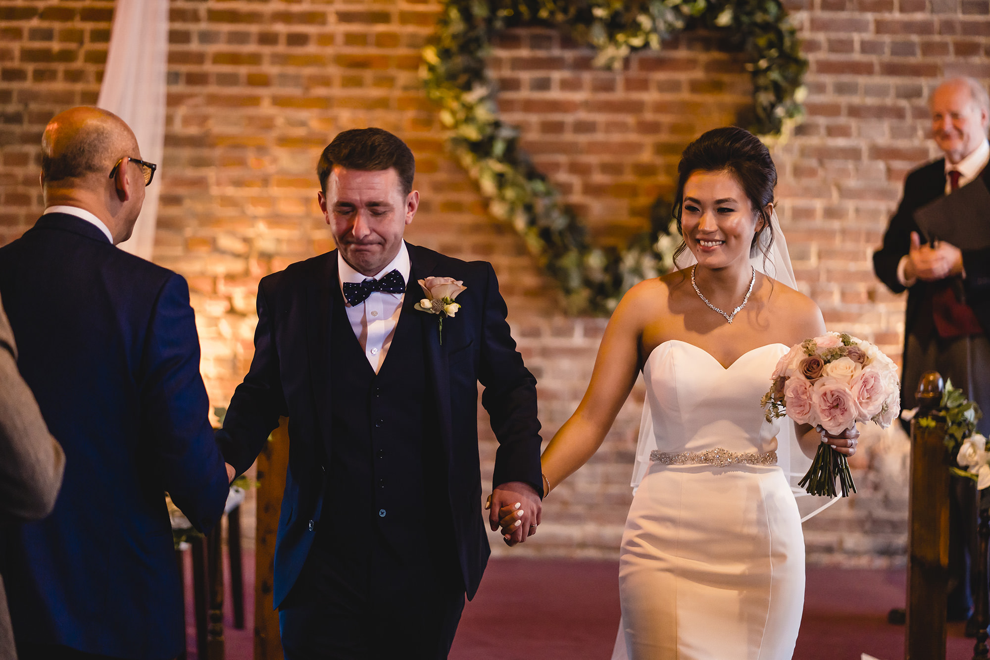 bride and groom exit wedding ceremony